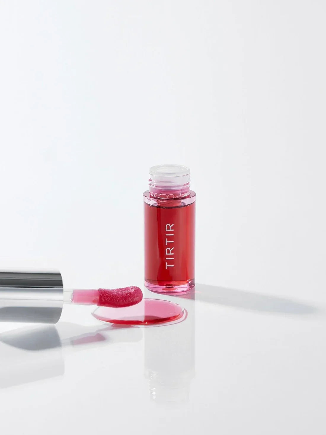 "Tirtir lip oil, glossy lip oil, hydrating lip oil, moisturizing lip care, shiny lips, nourishing lip gloss"